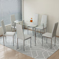 Table And Chair Set.Rectangular Dining Table With Tempered Glass Tabletop And Silver Plating Metal Legs.Paired With 6 Checkered Armless High Back Light Gray Chairs With Electroplated Metal Legs. Transparent Seats 6 Glass Metal