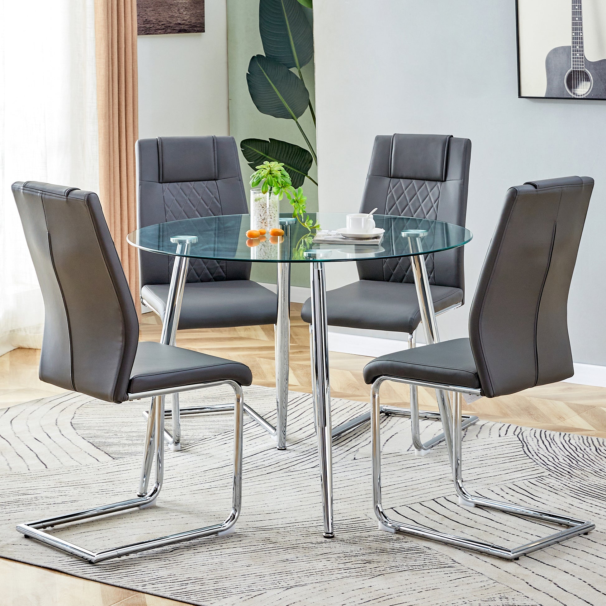 Table And Chair Set. 1 Table 4 Gray Chairs Round Dining Table With A 40 Inch Diameter Glass Tabletop And Silver Plated Metal Legs. 4 Gray Pu Chairs Dt 1164 001 Transparent Seats 4 Glass