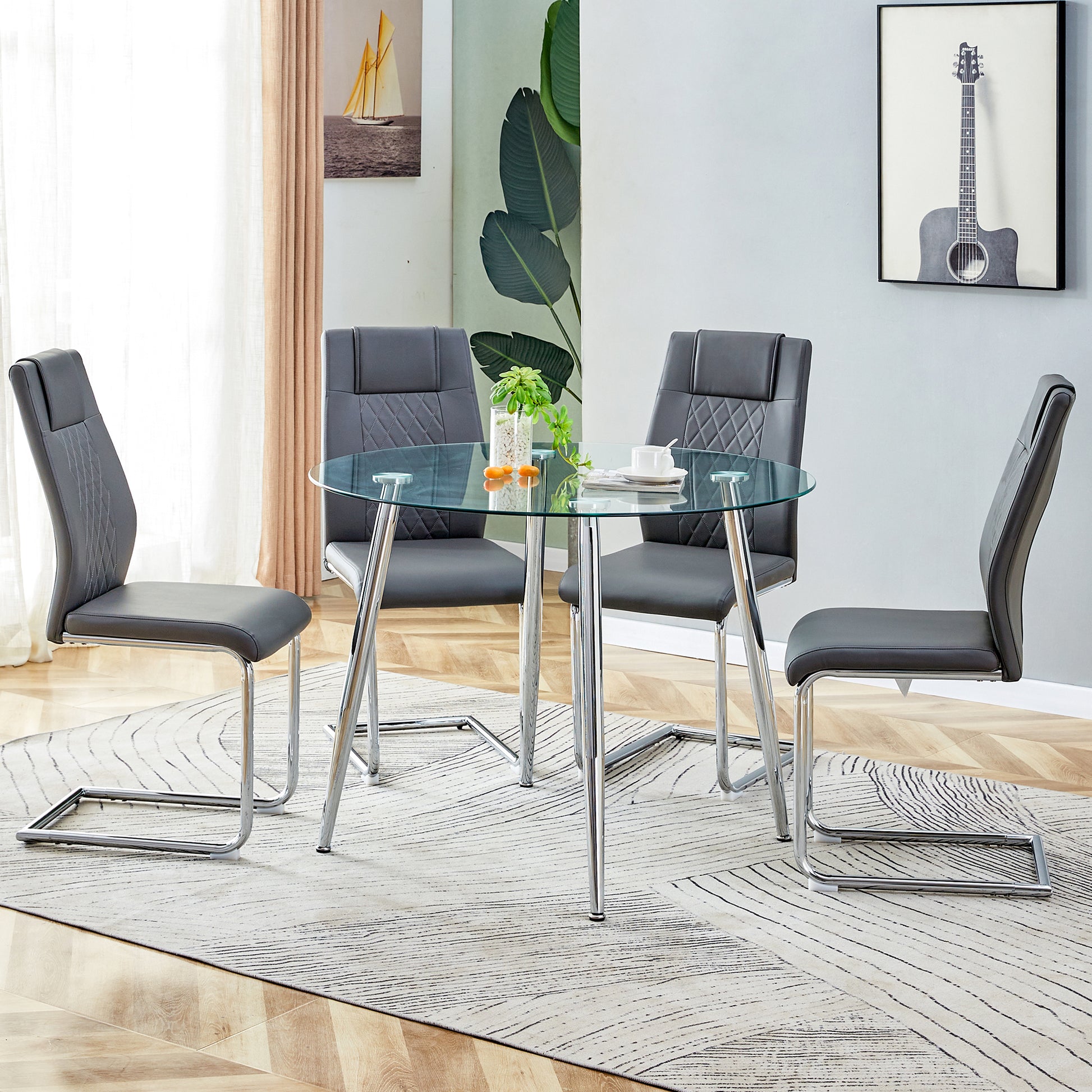 Table And Chair Set. 1 Table 4 Gray Chairs Round Dining Table With A 40 Inch Diameter Glass Tabletop And Silver Plated Metal Legs. 4 Gray Pu Chairs Dt 1164 001 Transparent Seats 4 Glass