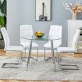Table And Chair Set. 1 Table 4 Chairs Set A Circular Dining Table With A 40 Inch Diameter Glass Tabletop And Electroplated Metal Legs. 4 White Pu Chairs Dt 1164 001 Transparent Seats 4 Glass
