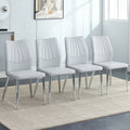 Four Light Gray Dining Chairs. A Medieval Modern Chair Made Of Pu Material With Soft Cushions And Silver Metal Legs. Suitable For Restaurants And Living Rooms Light Gray Pu