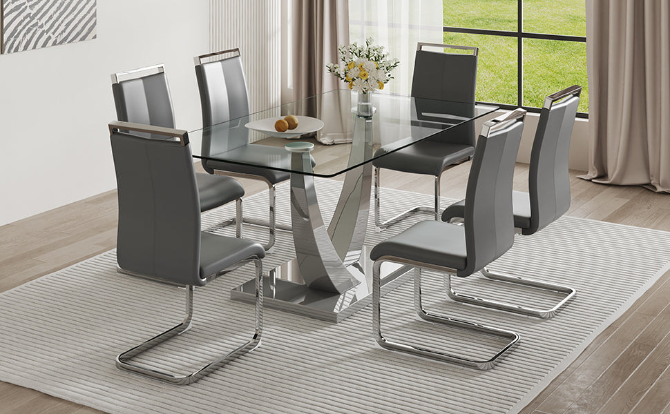 Table And Chair Set. Large Modern Rectangular Table With Glass Top And Silver Metal Legs. Furnished With Soft And Comfortable Pu Chairs With Faux Leather Upholstered Seats And Silver Metal Legs. Gray Silver Seats 6 Glass Metal