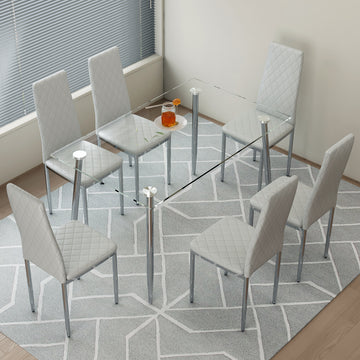 Table And Chair Set.Rectangular Dining Table With Tempered Glass Tabletop And Silver Plating Metal Legs.Paired With 6 Checkered Armless High Back Light Gray Chairs With Electroplated Metal Legs. Transparent Seats 6 Glass Metal