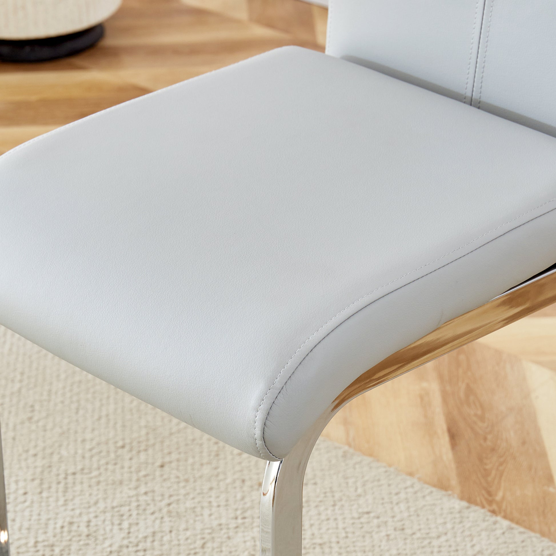 Table And Chair Set. A Rectangular Glass Dining Table With A 0.4 Inch Tempered Glass Tabletop And Mdf Board V Shaped Bracket, Paired With Chairs Consisting Of Pu Seat Cushions And Silver Metal Legs. Black Gray Seats 4 Tempered Glass