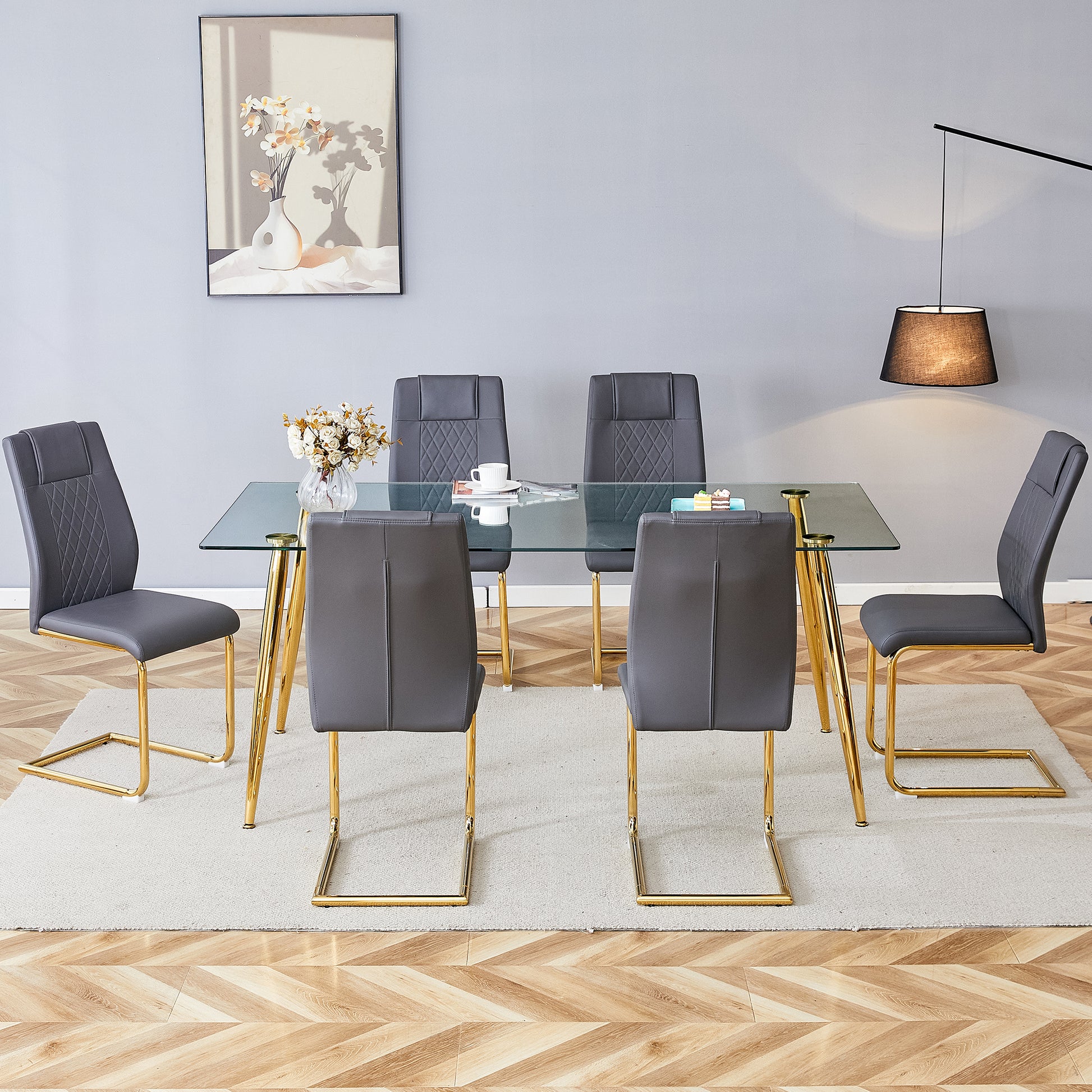 Table And Chair Set.Modern Rectangular Glass Dining Table With A Tempered Glass Tabletop And Metal Legs, Paired With Multiple Chairs Designed With Pu Cushions And Golden Metal Legs. Grey Gold Seats 6 Tempered Glass